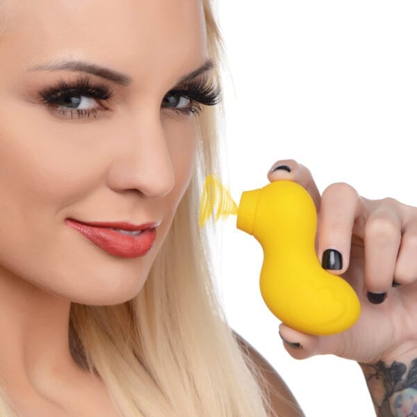 lady holding a yellow sucky ducky toy